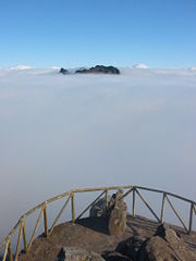 In mountainous areas one often finds the peaks above the clouds as here for the Pico Ruivo seen from Pico do Arieiro, Portugal.