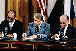 Sadat (left), Jimmy Carter (center) and Menachem Begin (right) at the Camp David Accords