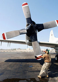 Rotating the Hamilton Standard 54H60 propeller on a US Navy EP-3E Orion's number four engine as part of pre-flight checks. The Orion is an anti-submarine warfare aircraft