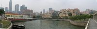 Panoramic view of the Singapore River. Once center of trade and commerce as the port of Singapore during its colonial times, it is now a tourist spot with numerous bars, pubs, and seafood restaurants along the river.