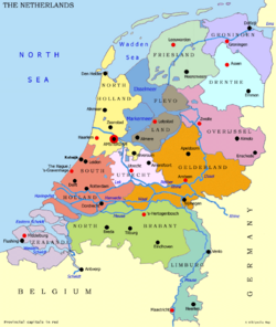 Map of the Netherlands, with red dots marking the capitals of the provinces and black dots marking the large cities. The national capital is Amsterdam, and the national seat of government is The Hague.