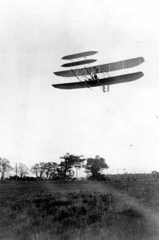 Wright Flyer III piloted by Orville over Huffman Prairie, October 4, 1905. Flight #46, covering 20¾ miles in 33 minutes 17 seconds. Last photographed flight of the year.