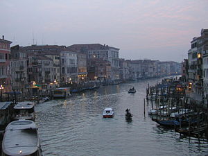 A winter sunset across the Grand Canal from the Rialto Bridge.