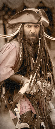 An actor costumed as Blackbeard