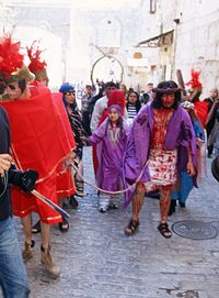Reenacting the Stations of the Cross in Jerusalem on the Via Dolorosa from the Lions' Gate to the Church of the Holy Sepulchre