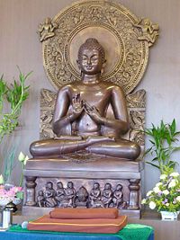 Replica of the Sarnath Buddha, depicting the Buddha giving the First Discourse. Image was cast in Thailand and located at the Dharma Hall of the Buddhist Fellowship at Poh Ern Shih, circa June 2007.