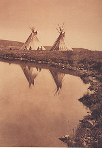 At the Water's Edge- Piegan (Blackfeet) Tipis. Photography by Edward S. Curtis, 1910.