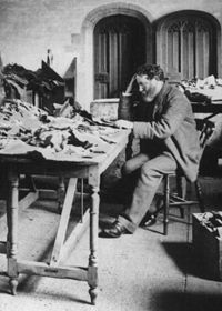 Solomon Schechter studying documents from the Cairo Geniza.