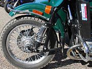 A wire wheel and pneumatic motorcycle tire on a Ural