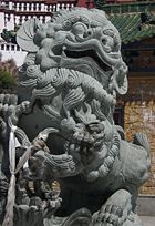 Snow Lions protect the entrance to the Potala Palace