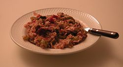Jambalaya with chicken, sausage, rice, tomatoes, celery, and spices.