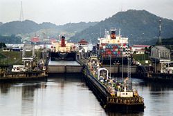 Two freighters running the Panama Canal's Miraflores Locks