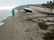 Fishing boats and bauxite cargo ships share the waterways near Alligator Pond, Jamaica.