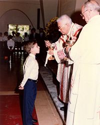 In the Western Church, the administration of the Eucharist to children requires that they have sufficient knowledge and careful preparation to receive the "body of Christ" with faith and devotion.