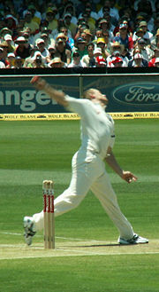 Cricketer Andrew Flintoff of England bowling.