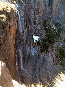 Tugela FallsLink title, with a drop in five free-leaping falls totaling 3,110 ft (947 m), is the world's second highest waterfall after Angel Falls in Venezuela. Tugela's tallest single drop is 1350 ft (411 m).