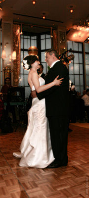 An Iranian groom and a Mexican-American bride enjoy their first dance as a mixed-race married couple.