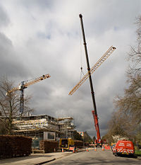 A telescopic crane dismantling a 40 m tower crane in Cambridge, UK.