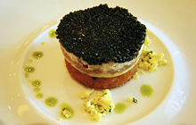 Ossetra caviar, with salmon creme fraiche and potato shallot croquette.