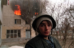 A teenage fighter in Chechnya. Photo by Mikhail Evstafiev