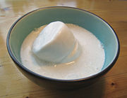 Canned coconut milk can be solid on opening the can. Heating it will make it liquid.