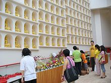 Devotees celebrating Vesak at the Wall of the Golden Buddhas of Poh Ern Shih on May 31, 2007.