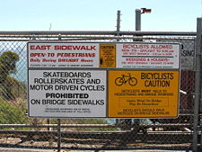 Signs prohibit pedestrian traffic at night and limit bicycle access.