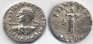 2. Silver drachm of Menander I (155-130 B.C.E.).Obv: Greek legend, ΒΑΣΙΛΕΩΣ ΣΩΤΗΡΟΣ ΜΕΝΑΝΔΡΟΥ (BASILEOS SOTEROS MENANDROU) lit. "Of Saviour King Menander". Rev: Kharosthi legend: MAHARAJA TRATASA MENADRASA "Saviour King Menander." Athena advancing right, with thunderbolt and shield. Taxila mint mark.