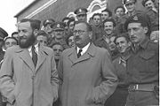 Nathan Yellin-Mor (center) and Matityahu Shmueliwitz in front of the Acre prison, after their release in 1949.