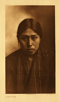 Suquamish woman photographed by Edward S. Curtis in 1913.
