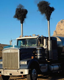 Diesel exhaust from a large truck starting up in USA with old technology device.