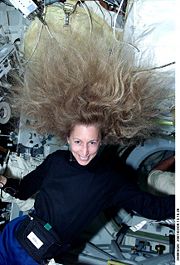 Astronaut Marsha Ivins demonstrates the effect of weightlessness on long hair during STS-98