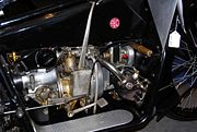 The transmission on this 1921 ABC motorcycle is located behind the engine and shifts by a long hand-operated lever on its right side.