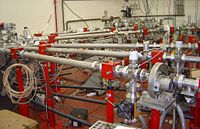 Beam lines leading from the Van de Graaff accelerator to various experiments, in the basement of the Jussieu Campus in Paris.