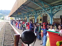 A excited crowd receives the Nilgiri Mountain Train at the Ooty station.
