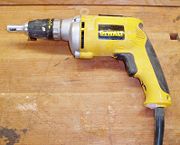 Electric screw gun used to drive drywall screws.