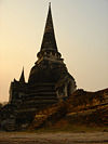Sharp-pointed pinnacle atop square shape, known as a chedi, is a distinct Thai style.