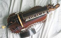 The hurdy gurdy is played by a crank with the right hand and keys with the left