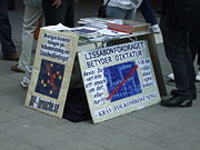 Members of the LaRouche movement in Stockholm protest the Treaty of Lisbon with pictures rearranging the stars of the Flag of Europe into a swastika