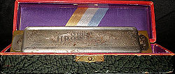 A harmonica in its case.