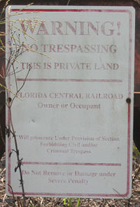 A sign warning against trespassing.