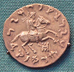Coin of Philoxenus, unarmed, making a blessing gesture with the right hand.