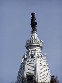 Bronze statue of William Penn atop City Hall tower.