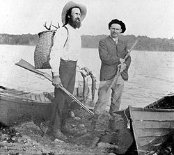 An Adirondack guide (left) and his sport.