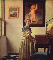 A lady standing at a virginal, by Jan Vermeer van Delft
