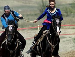 Riders in traditional dress demonstrate Kazakhstan's equestrian culture by playing a kissing game, Kuuz Kuu ("Catch the Girl"), one of a number of traditional games played on horseback.