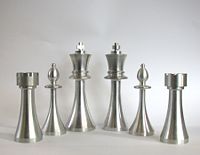 Chess pieces shaped with a lathe.