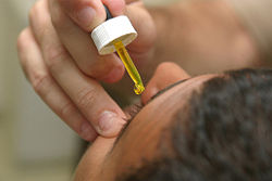 Fluorescein in dropper used for eye examination.