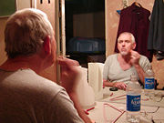 Broadway actor Jim Brochu applies makeup before the opening night of a play.