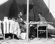 Lincoln in McClellan's tent President Abraham Lincoln and Gen. George B. McClellan in the general's tent at Sharpsburg, Maryland after the Battle of Antietam, Maryland, October 3, 1862. Photographer Alexander Gardner (1821–1882).